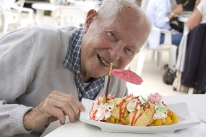 Senior man eating diet of ice cream