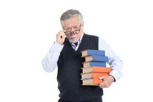 Smart senior man with stack of books