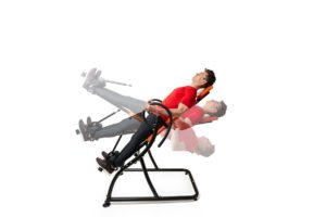 Man-hanging-upside-down-on-an-inversion-table